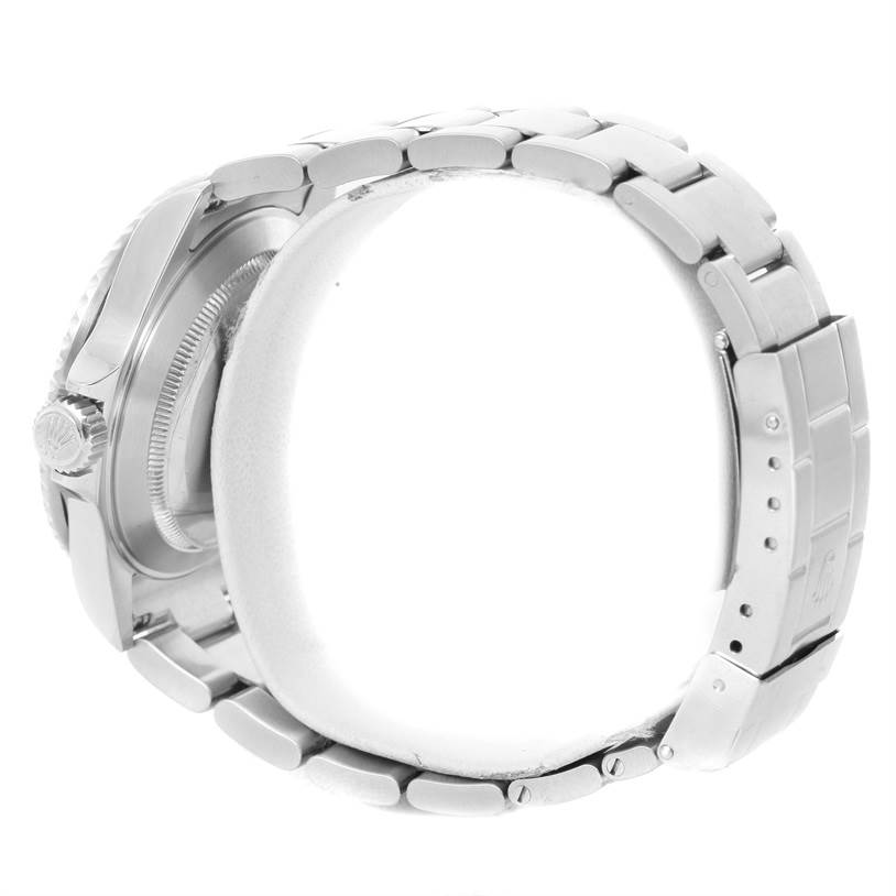 The image shows a side view of a Rolex Submariner 16610 Men
s Stainless Steel Black Dial 16610 Men
s Stainless Steel Black Dial watch, highlighting the bracelet and the crown.