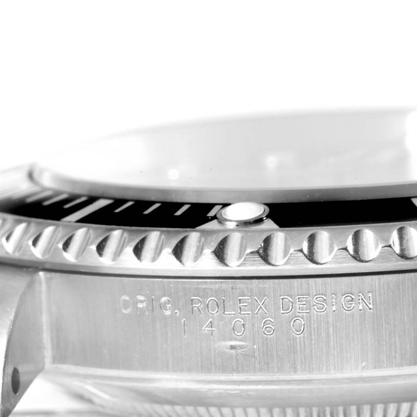 This close-up angle shows the bezel, side profile, and engraving of the Rolex Submariner 14060 Men
s Stainless Steel Black Dial 14060 Men
s Stainless Steel Black Dial model.