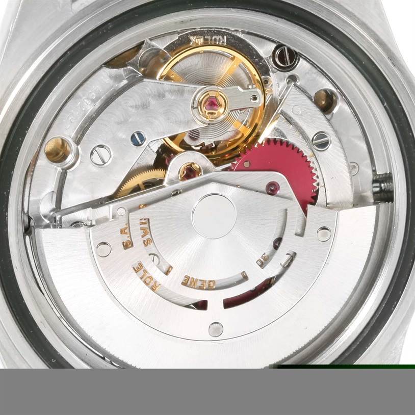This image shows the internal mechanism of a Rolex Submariner 14060 Men
s Stainless Steel Black Dial 14060 Men
s Stainless Steel Black Dial watch, viewed from the back, revealing gears and the rotor.