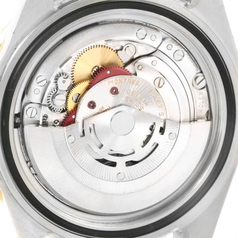 This image shows the internal mechanism of a Rolex Submariner 16613 Men
s Steel and Gold (two tone) Black Dial 16613 Men
s Steel and Gold (two tone) Black Dial watch from a rear angle.