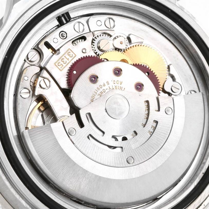 The image shows the internal movement and gears of a Rolex Submariner 16610 Men
s Stainless Steel Black Dial 16610 Men
s Stainless Steel Black Dial watch from a close-up, back angle.