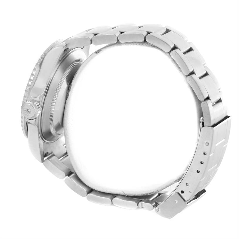 The image shows a side profile of the Rolex Submariner 16610 Men
s Stainless Steel Black Dial 16610 Men
s Stainless Steel Black Dial watch, highlighting the crown, case, and bracelet with its clasp.