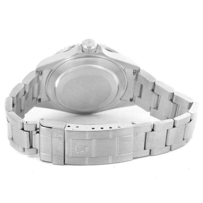 The image shows the backside of a Rolex Submariner 16610 Men
s Stainless Steel Black Dial 16610 Men
s Stainless Steel Black Dial watch, highlighting the clasp, bracelet, and case back.