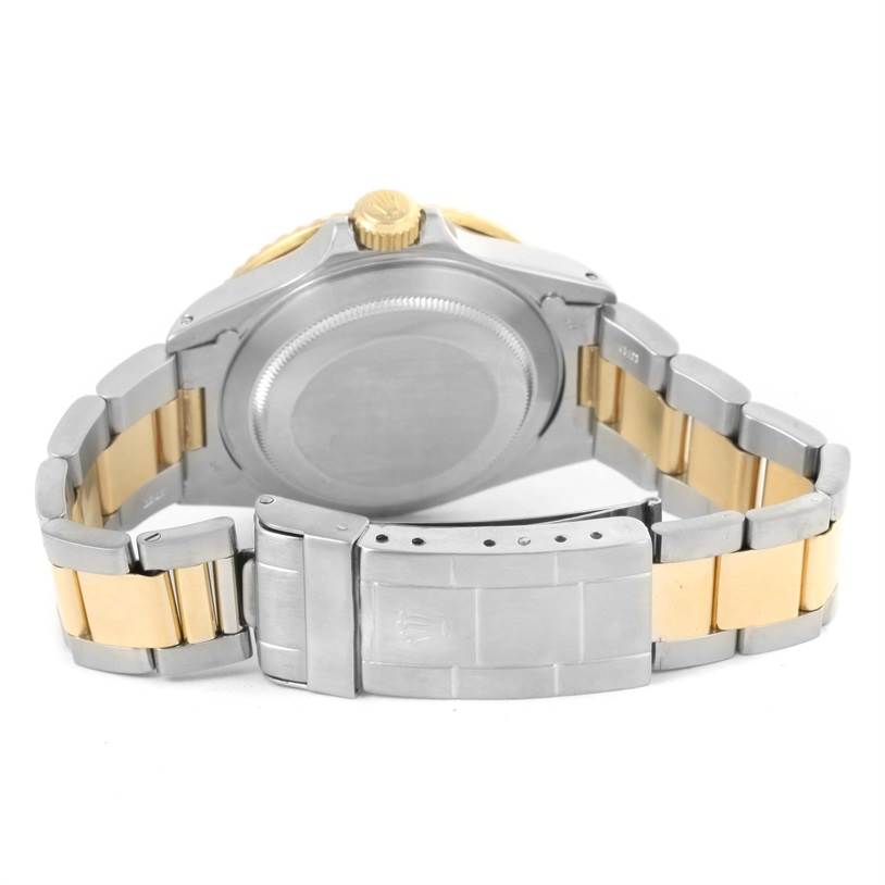 The image shows the back case, crown, and bracelet, including the clasp, of a Rolex Submariner 16803 Men's Steel and Gold (two tone) Blue Dial 16803 Men's Steel and Gold (two tone) Blue Dial watch from the rear angle.