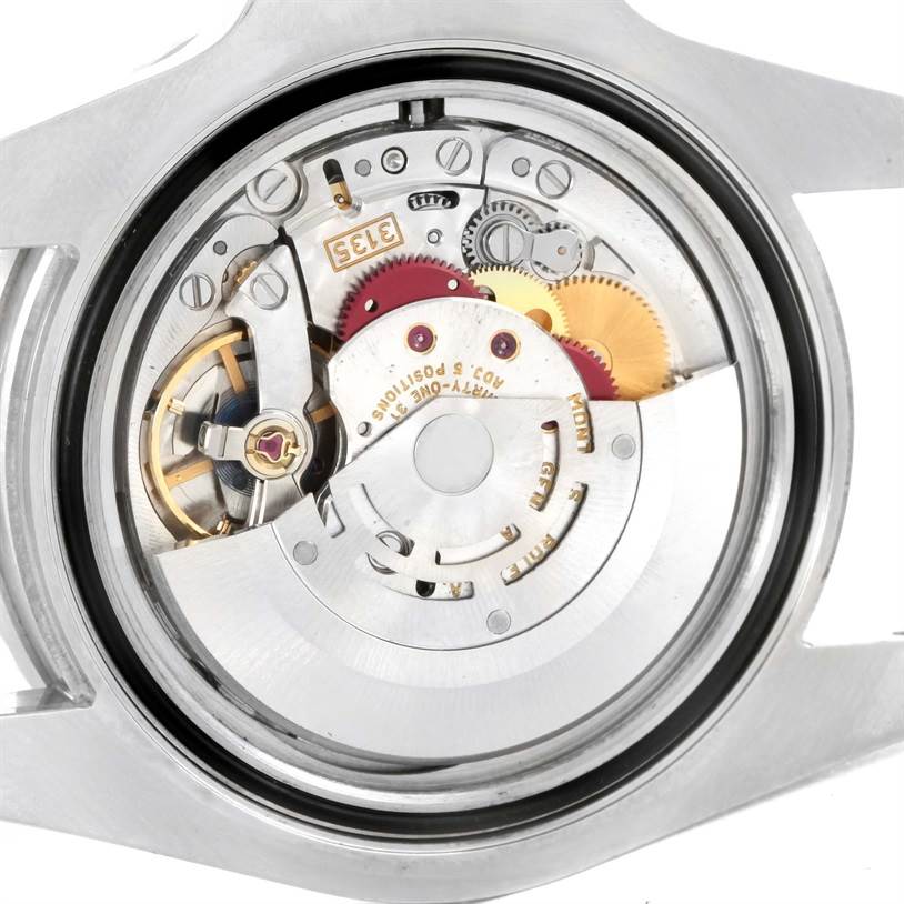 This image shows the movement and inner mechanisms of a Rolex Submariner 116610 Men
s Stainless Steel Black Dial 116610 Men
s Stainless Steel Black Dial watch from a back angle.