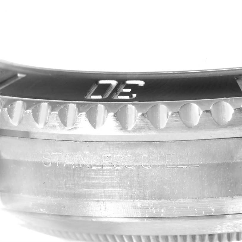 The image shows a close-up of the side view of the bezel and the stainless steel casing of a Rolex Submariner 116610 Men
s Stainless Steel Black Dial 116610 Men
s Stainless Steel Black Dial watch.