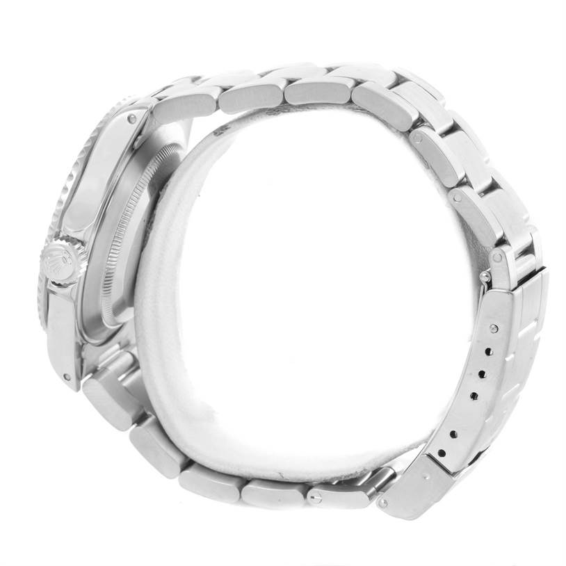 The image shows a side view of a Rolex Submariner 14060 Men
s Stainless Steel Black Dial 14060 Men
s Stainless Steel Black Dial watch, highlighting its bracelet and clasp.