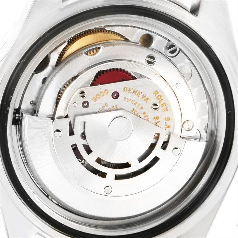 The image shows the movement and inner mechanism of a Rolex Submariner 14060 Men
s Stainless Steel Black Dial 14060 Men
s Stainless Steel Black Dial watch from a rear angle.