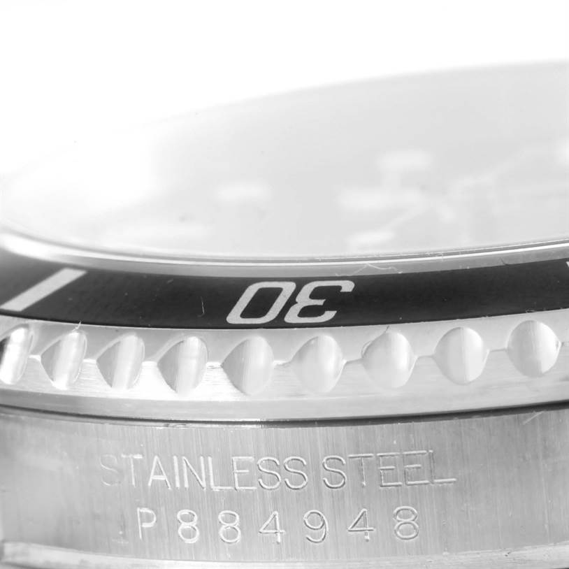 The image shows a close-up angle of the bezel and case side of a Rolex Submariner 16610 Men
s Stainless Steel Black Dial 16610 Men
s Stainless Steel Black Dial watch, highlighting the "30" marker and "STAINLESS STEEL" inscription.