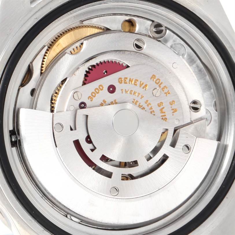 The image shows the inner mechanical movement of the Rolex Submariner 14060 Men
s Stainless Steel Black Dial 14060 Men
s Stainless Steel Black Dial watch viewed from the back.