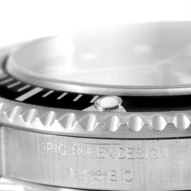 The image shows a close-up side view of the bezel and case of a Rolex Submariner 14060 Men
s Stainless Steel Black Dial 14060 Men
s Stainless Steel Black Dial watch, highlighting the model engraving.
