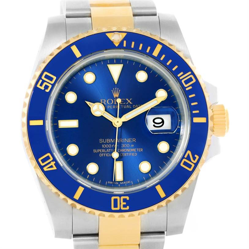The image shows a Rolex Submariner 116613 Men's Steel and Gold (two tone) Blue Dial 116613 Men's Steel and Gold (two tone) Blue Dial watch face with a blue dial, gold accents, and part of the two-tone metal bracelet.