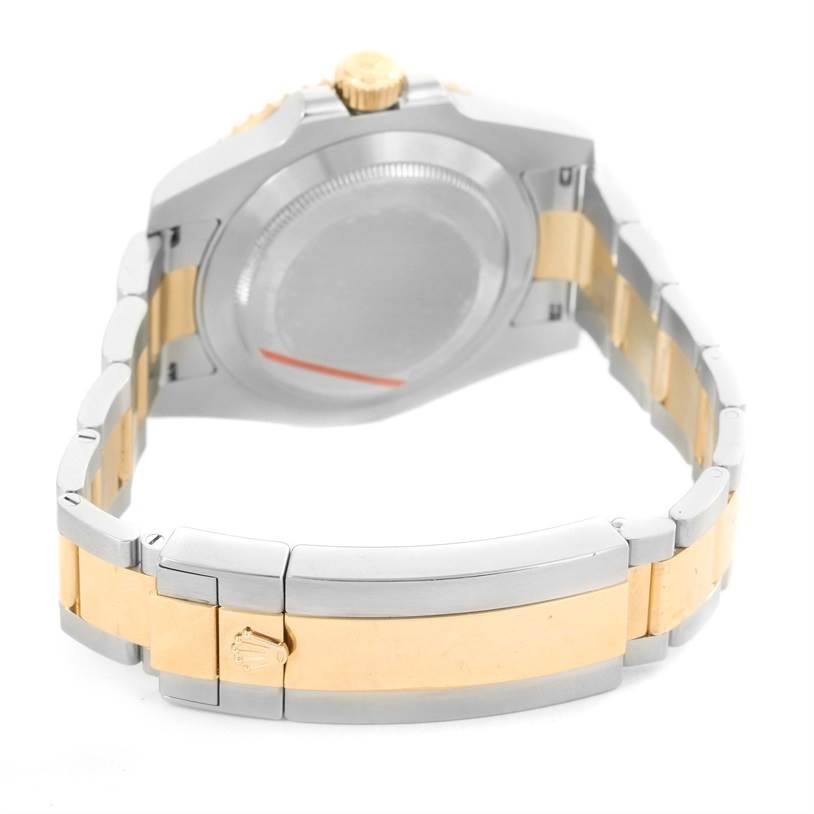 The image shows the back and clasp of a Rolex Submariner 116613 Men's Steel and Gold (two tone) Blue Dial 116613 Men's Steel and Gold (two tone) Blue Dial watch, highlighting its two-tone bracelet and case back.