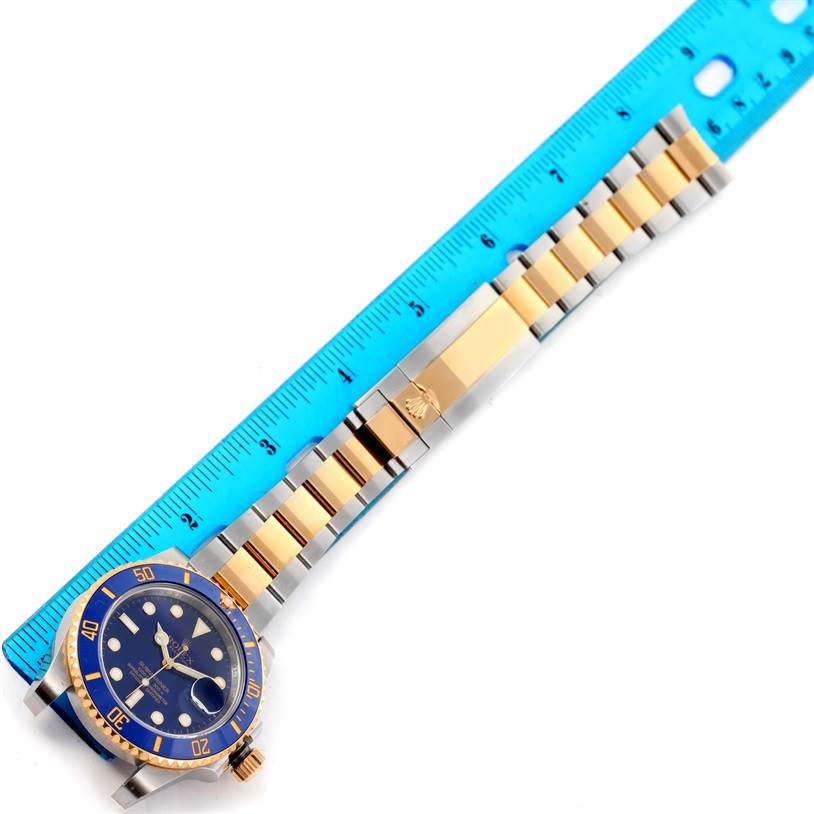 This top-down view displays the face, bezel, and bracelet of the Rolex Submariner 116613 Men's Steel and Gold (two tone) Blue Dial 116613 Men's Steel and Gold (two tone) Blue Dial.