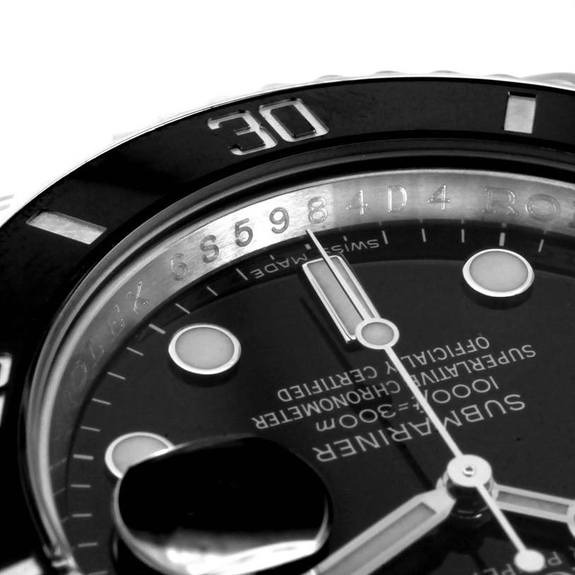 The image shows a close-up angle of the dial and bezel of a Rolex Submariner 116610 Men
s Stainless Steel Black Dial 116610 Men
s Stainless Steel Black Dial watch, featuring the minute hand and indices.