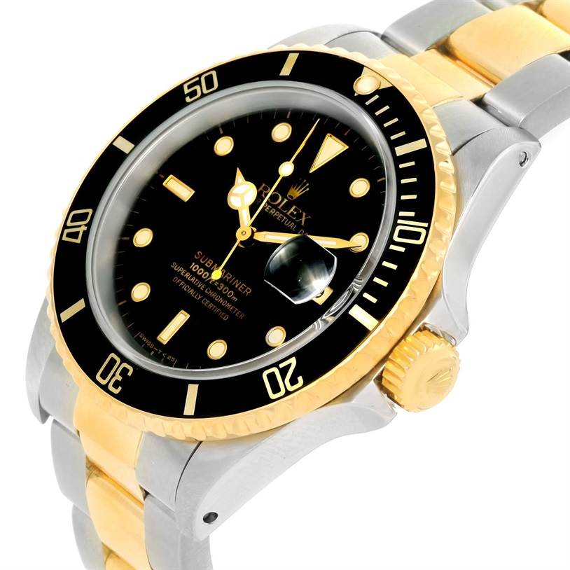 The image shows a close-up angle of a Rolex Submariner 16613 Men's Steel and Gold (two tone) Black Dial 16613 Men's Steel and Gold (two tone) Black Dial watch, highlighting its bezel, dial, crown, and two-tone bracelet.