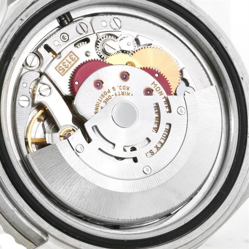 This image shows the inner mechanical movement of a Rolex Submariner 16610 Men
s Stainless Steel Black Dial 16610 Men
s Stainless Steel Black Dial watch, viewed from the back.