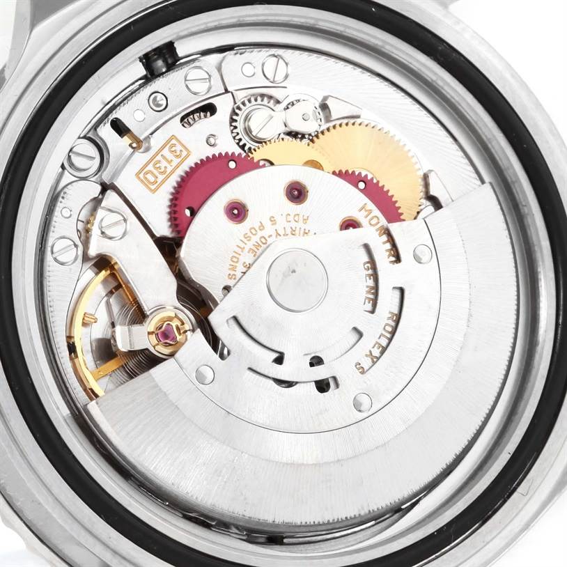 The image shows the internal mechanical movement of a Rolex Submariner 14060 Men
s Stainless Steel Black Dial 14060 Men
s Stainless Steel Black Dial watch from a back angle.