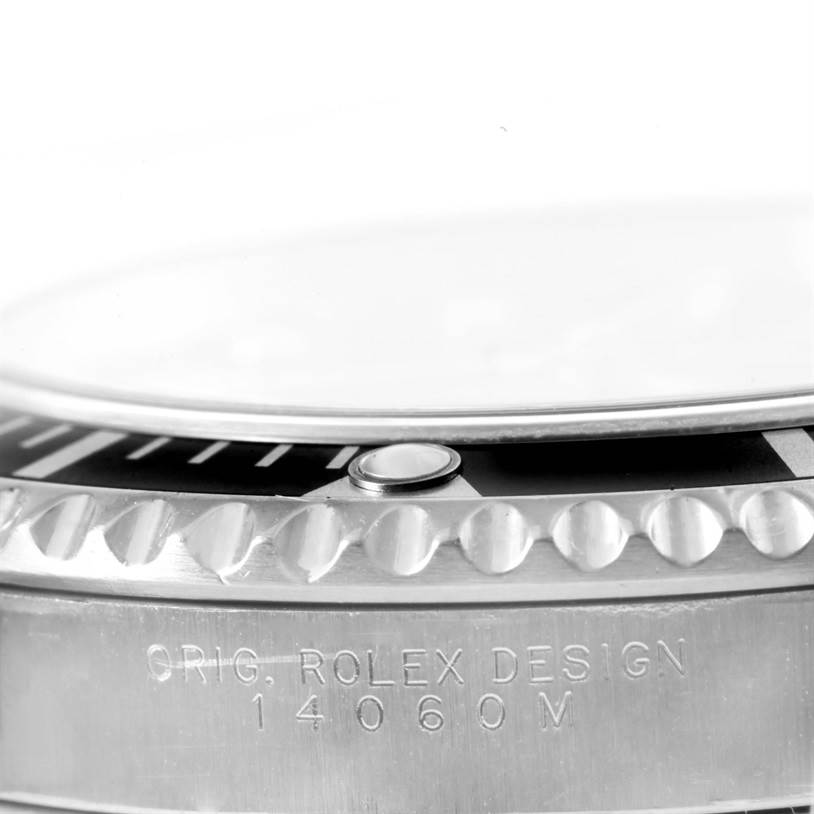 This image shows a close-up side angle of the case and bezel of a Rolex Submariner 14060 Men
s Stainless Steel Black Dial 14060 Men
s Stainless Steel Black Dial watch, displaying the model number 14060M.