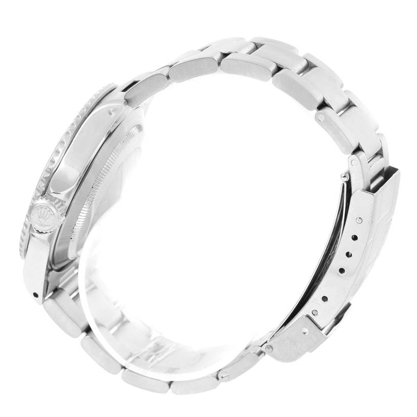 This side view of the Rolex Submariner 14060 Men
s Stainless Steel Black Dial 14060 Men
s Stainless Steel Black Dial watch shows the bracelet, clasp, and crown.