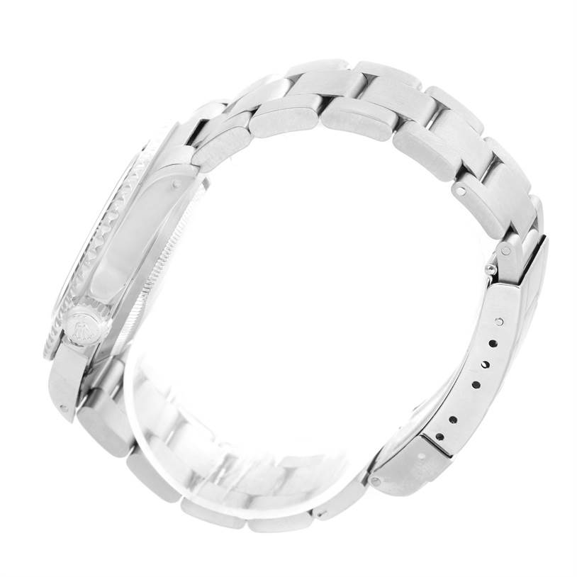 The image shows the side view of a Rolex Submariner 14060 Men
s Stainless Steel Black Dial 14060 Men
s Stainless Steel Black Dial watch, highlighting the bracelet, clasp, and case.