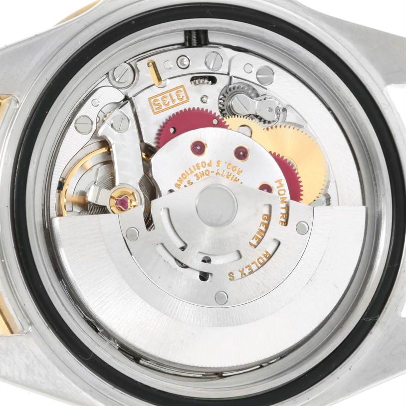 The image shows the internal mechanical movement of a Rolex Submariner 16613 Men's Steel and Gold (two tone) Grey Dial 16613 Men's Steel and Gold (two tone) Grey Dial watch from a rear view angle.