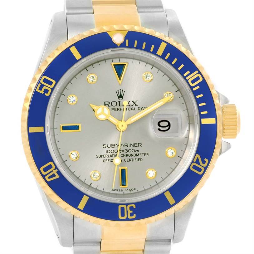 This image shows a frontal view of the Rolex Submariner 16613 Men's Steel and Gold (two tone) Grey Dial 16613 Men's Steel and Gold (two tone) Grey Dial watch with a blue and gold bezel and bracelet, displaying the face and date window.