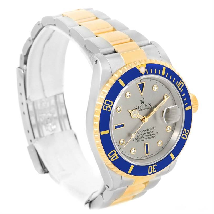 The Rolex Submariner 16613 Men's Steel and Gold (two tone) Grey Dial 16613 Men's Steel and Gold (two tone) Grey Dial watch is shown at a slight angle, displaying its blue bezel, silver dial, and two-tone bracelet.