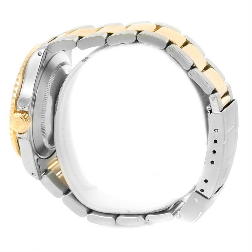 The image shows a side view of a Rolex Submariner 16613 Men's Steel and Gold (two tone) Grey Dial 16613 Men's Steel and Gold (two tone) Grey Dial watch, highlighting the bracelet and the crown.