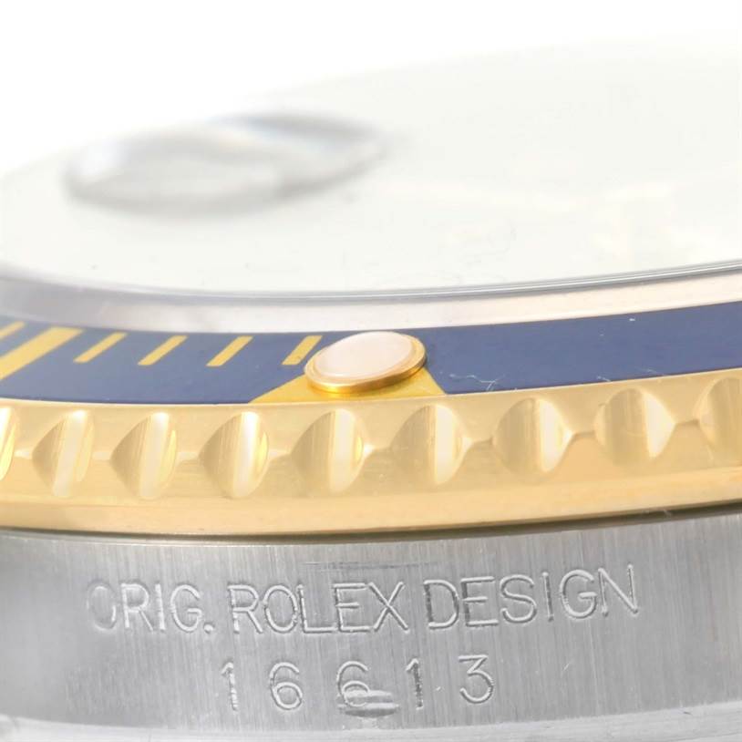 The image shows a close-up angle of the bezel and case of a Rolex Submariner 16613 Men's Steel and Gold (two tone) Grey Dial 16613 Men's Steel and Gold (two tone) Grey Dial, highlighting the model number 16613.