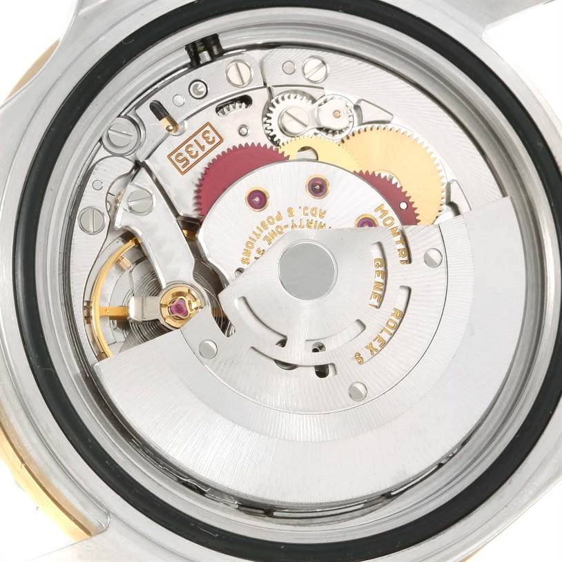 This image shows the internal mechanical movement of the Rolex Submariner 16613 Men's Steel and Gold (two tone) Grey Dial 16613 Men's Steel and Gold (two tone) Grey Dial watch from the back angle.