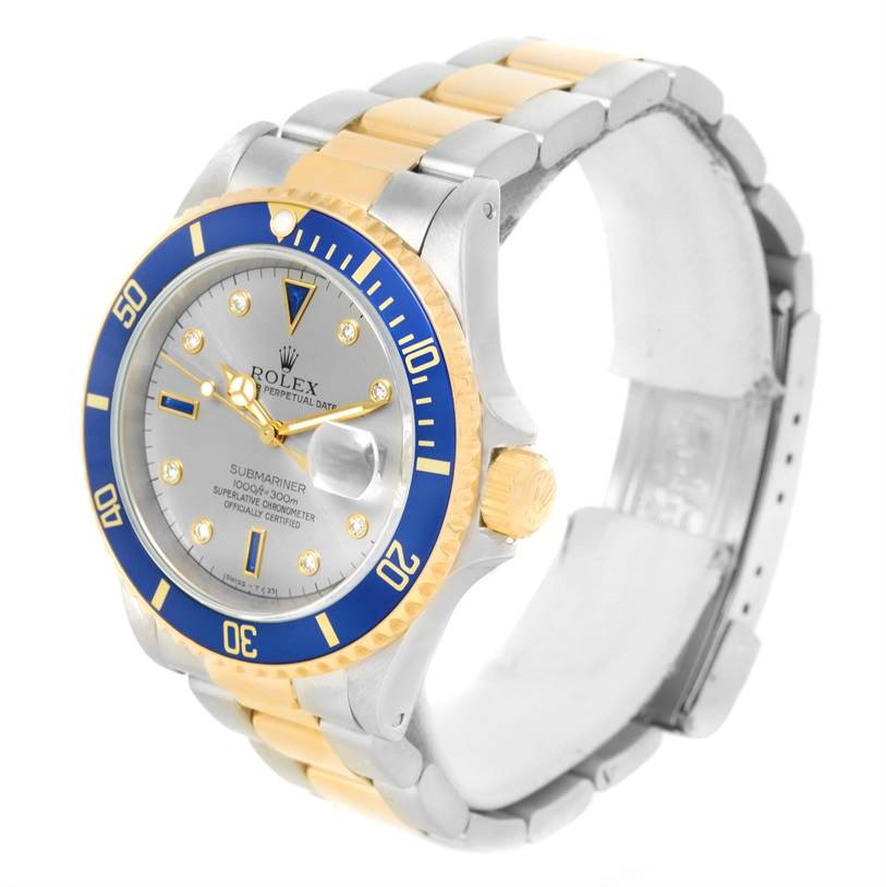 The image shows a Rolex Submariner 16613 Men's Steel and Gold (two tone) Grey Dial 16613 Men's Steel and Gold (two tone) Grey Dial watch from an angled view highlighting the dial, bezel, and bracelet.