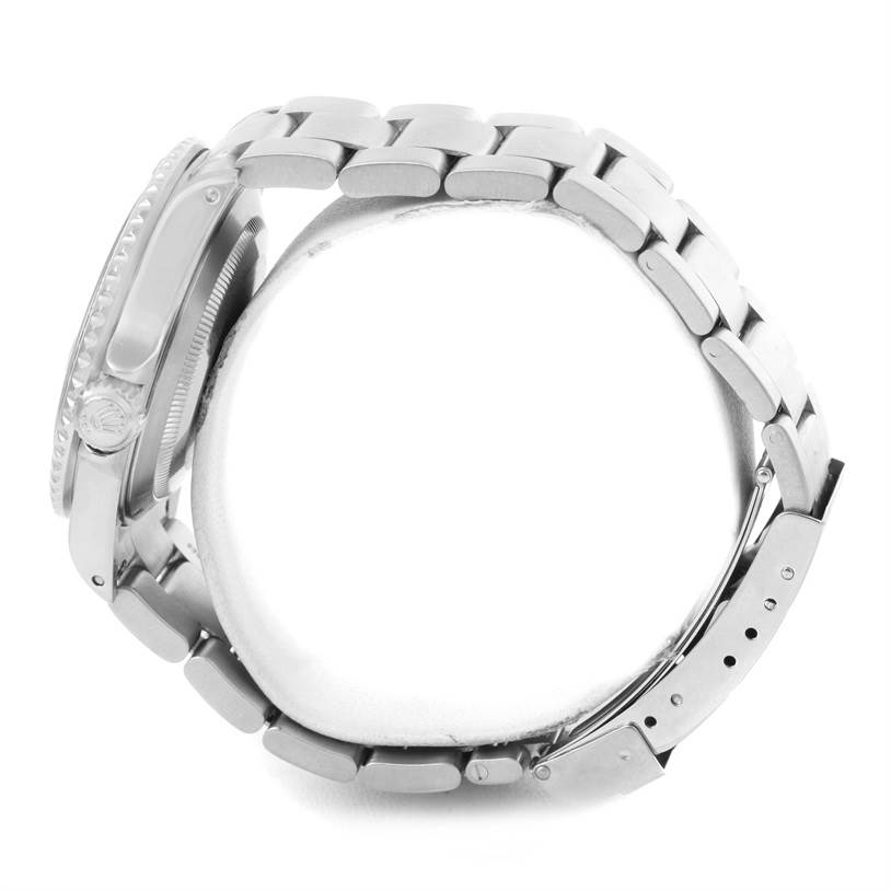 The image shows a side view of a Rolex Submariner 16610 Men
s Stainless Steel Black Dial 16610 Men
s Stainless Steel Black Dial, highlighting the bracelet, clasp, and crown.