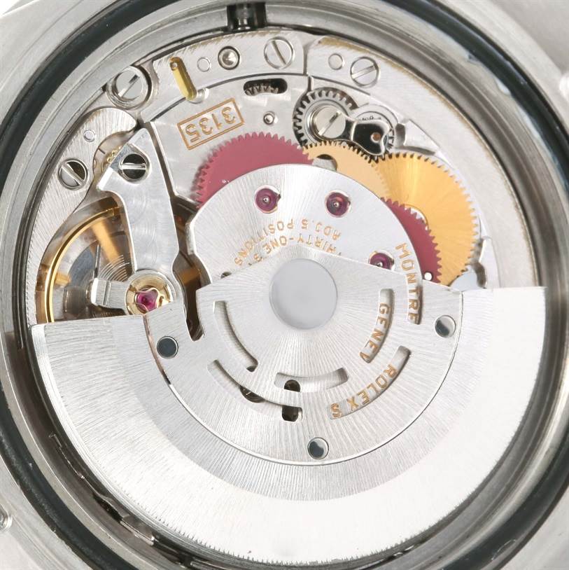 The image shows the internal mechanical movement of a Rolex Submariner 16610 Men
s Stainless Steel Black Dial 16610 Men
s Stainless Steel Black Dial watch, viewed from the back angle.