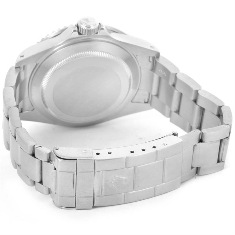 The image shows the back case, crown, and bracelet of a Rolex Submariner 16610 Men
s Stainless Steel Black Dial 16610 Men
s Stainless Steel Black Dial watch angled from the rear.