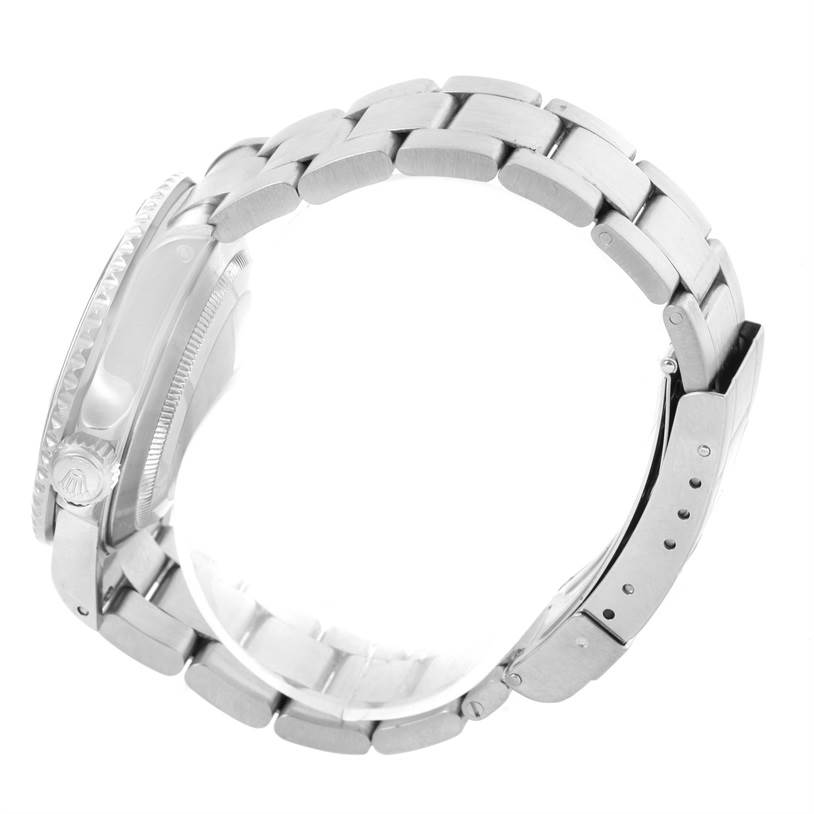 The image shows a side view of a Rolex Submariner 16610 Men
s Stainless Steel Black Dial 16610 Men
s Stainless Steel Black Dial watch, highlighting its bracelet and side of the case.