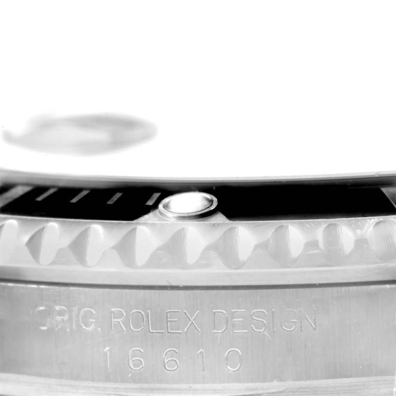 The image shows a close-up of the side view of the bezel and case with model engraving of the Rolex Submariner 16610 Men
s Stainless Steel Black Dial 16610 Men
s Stainless Steel Black Dial.