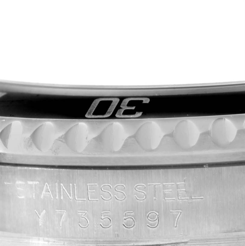 This image shows a close-up of the bezel and case markings on a Rolex Submariner 16610 Men
s Stainless Steel Black Dial 16610 Men
s Stainless Steel Black Dial watch.