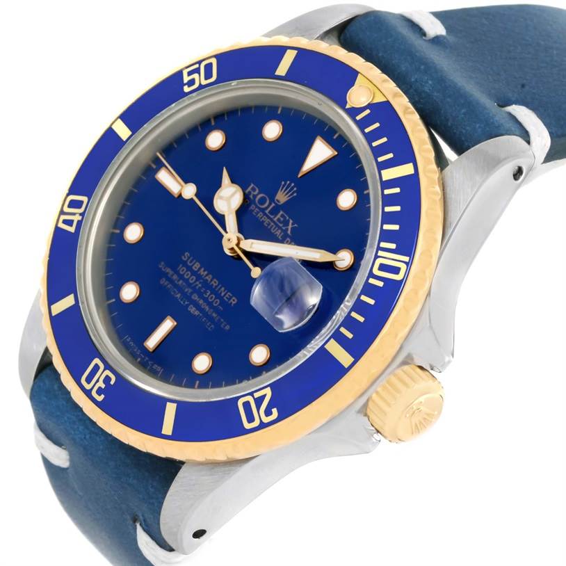 This image shows a close-up view of the Rolex Submariner 16803 Men
s Steel and Gold (two tone) Blue Dial 16803 Men
s Steel and Gold (two tone) Blue Dial watch face, bezel, crown, and part of the strap at an angled perspective.