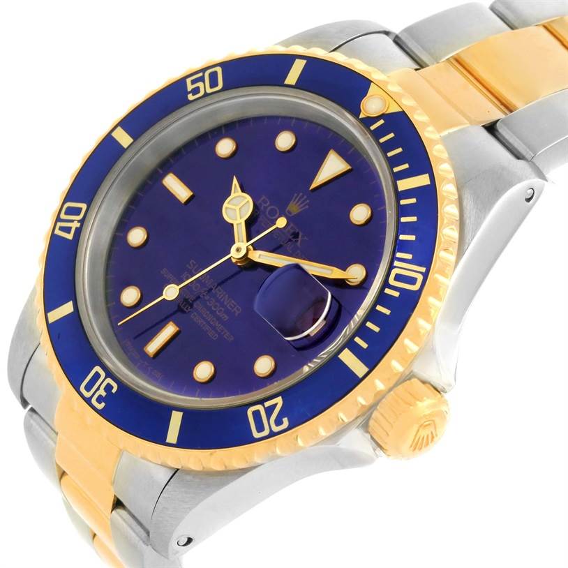 The image shows a side angle of a Rolex Submariner 16613 Men
s Steel and Gold (two tone) Blue Dial 16613 Men
s Steel and Gold (two tone) Blue Dial watch highlighting its bezel, crown, and bracelet.