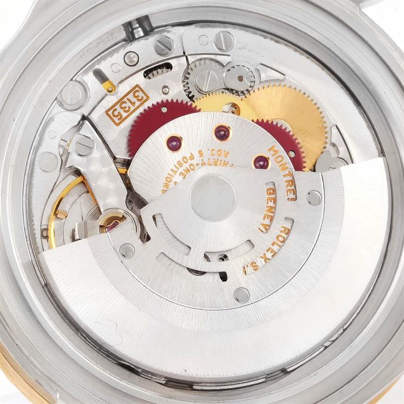This image shows a close-up of the internal mechanism and movement of a Rolex Submariner 16613 Men
s Steel and Gold (two tone) Blue Dial 16613 Men
s Steel and Gold (two tone) Blue Dial watch.