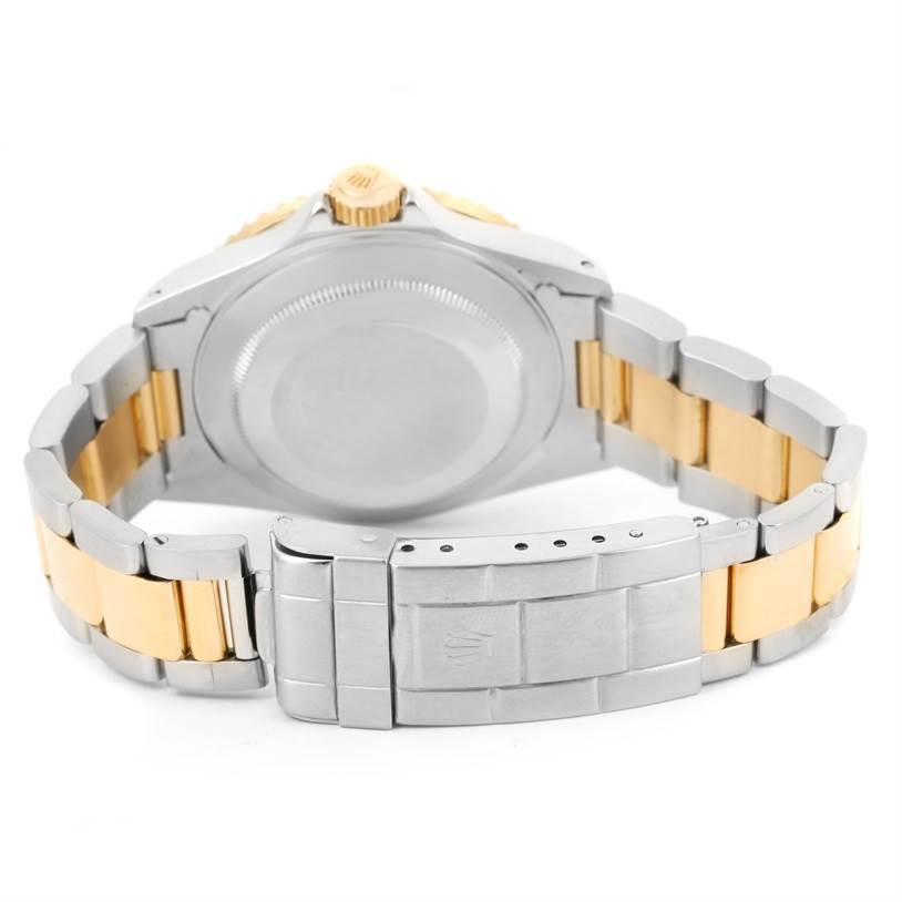 The image shows the back and bracelet of a Rolex Submariner 16613 Men
s Steel and Gold (two tone) Blue Dial 16613 Men
s Steel and Gold (two tone) Blue Dial watch from a rear angle.