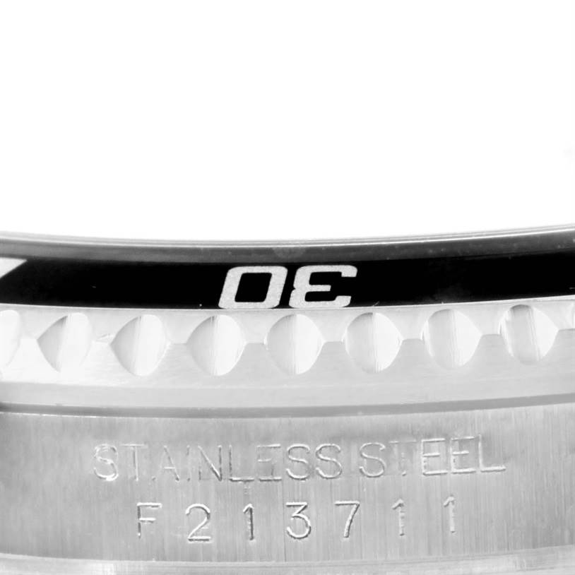 This image shows a close-up of the bezel and case of a Rolex Submariner 16610 Men
s Stainless Steel Black Dial 16610 Men
s Stainless Steel Black Dial watch, displaying its "30" marker and serial number engraving.