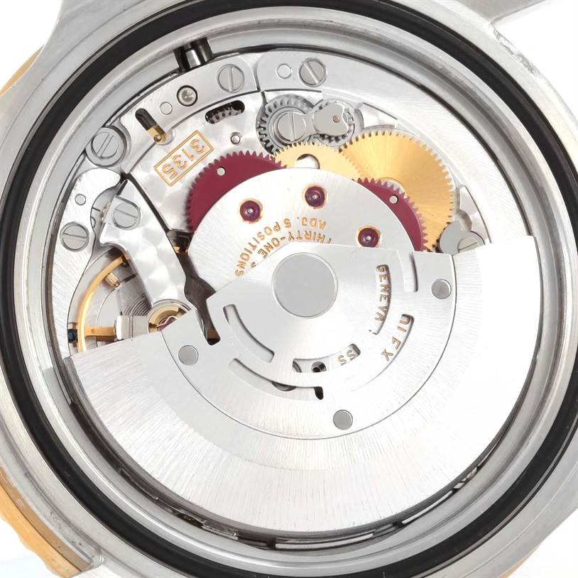 This image shows a close-up view of the inner movement of a Rolex Submariner 16613 Men's Steel and Gold (two tone) Blue Dial 16613 Men's Steel and Gold (two tone) Blue Dial watch.