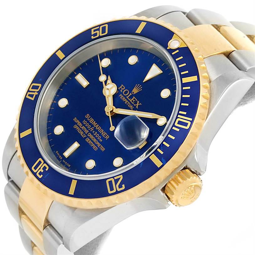 The image shows a Rolex Submariner 16613 Men's Steel and Gold (two tone) Blue Dial 16613 Men's Steel and Gold (two tone) Blue Dial watch at a three-quarter angle, featuring the bezel, dial, crown, and a portion of the bracelet.