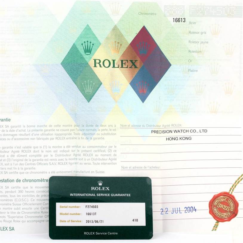 The image shows the warranty papers and service guarantee card for a Rolex Submariner 16613 Men's Steel and Gold (two tone) Blue Dial 16613 Men's Steel and Gold (two tone) Blue Dial model 16613.