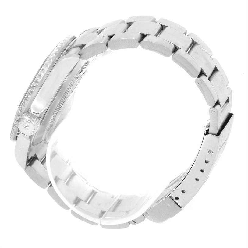 Side angle view of a Rolex Submariner 16610 Men
s Stainless Steel Black Dial 16610 Men
s Stainless Steel Black Dial showing its stainless steel bracelet, crown, and case.