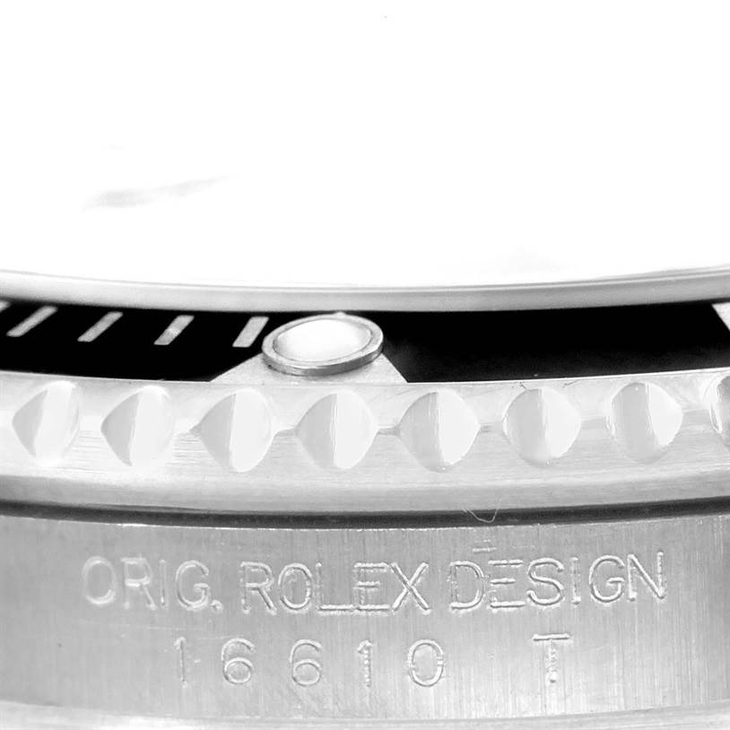 The image shows the side view of the bezel and case of a Rolex Submariner 16610 Men
s Stainless Steel Black Dial 16610 Men
s Stainless Steel Black Dial, highlighting the model number engraved.