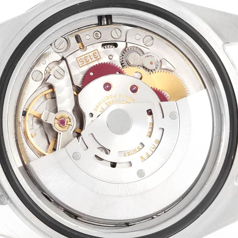 The image shows the internal movement mechanisms of a Rolex Submariner 16610 Men
s Stainless Steel Black Dial 16610 Men
s Stainless Steel Black Dial watch, viewed from the back case.