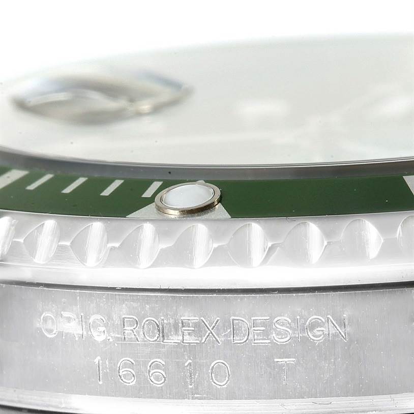 This close-up image shows the bezel, edge of the dial, and engraving on the case of a Rolex Submariner 16610LV Men
s Stainless Steel Black Dial 16610LV Men
s Stainless Steel Black Dial model 16610.